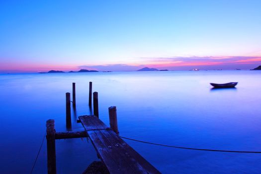 Sunset along a wooden pier at magic hour