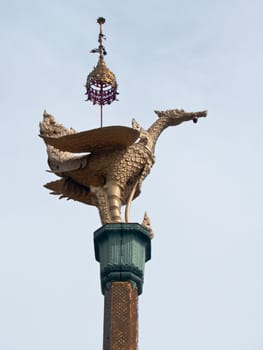 Swan statue on top of pillar in Nang Sao Temple, Samut Sakhon, Thailand