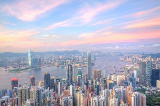 Hong Kong at sunset time with many office buildings, it is the view from the Peak.