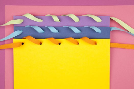 colorful paper notes with ribbon
