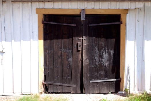 Old wooden door with rosty hinges