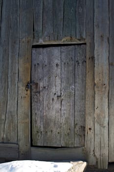 Old wooden door with rosty lock