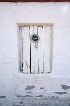 Old wooden door with arrow signal