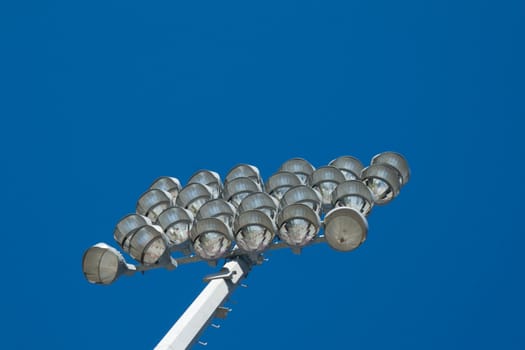 An array of lamps on a stadium lighting support