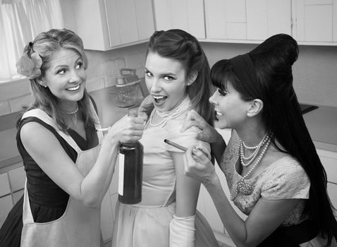 Young woman goes along with friends to smoke and drink in a kitchen