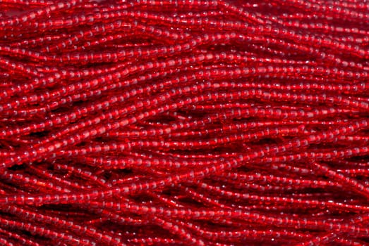 Indian fabric design with red beads texture 