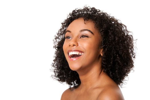 Face of a beautiful happy smiling laughing young female teenager fashion model with curly hairstyle, isolated.
