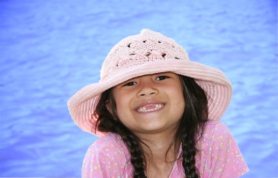 Little girl by the water