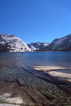 Olmsted Point, located in Yosemite National Park, is a viewing area like Glacier Point that offers an amazing view looking South-West into Yosemite. One is able to see the back side of Half Dome (where people climb the cables) and Tenaya Canyon. To the east you get an elevated view of Tenaya Lake. While not as popular as other viewing areas like Tunnel View & Glacier Point, Olmsted Point is worth the stop.