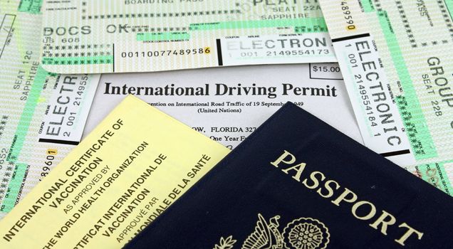 Collection of Travel Documents - Passport, International Driving Permit, International Vaccination Certificate and Airline Boarding Passes.
