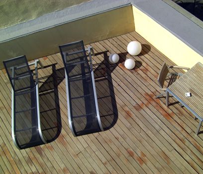 patio lounge chairs on a terrace, bird´s eye view