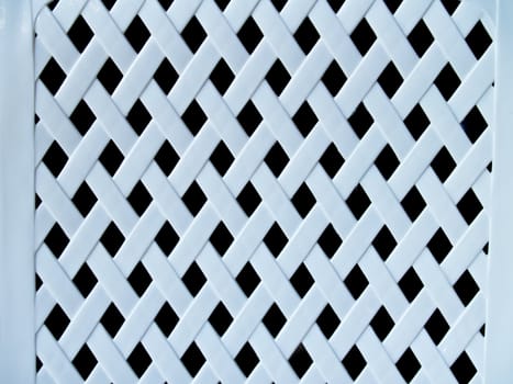 Closeup white plastic lattice on black background