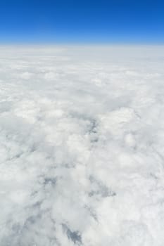 An image of a flight over the clouds