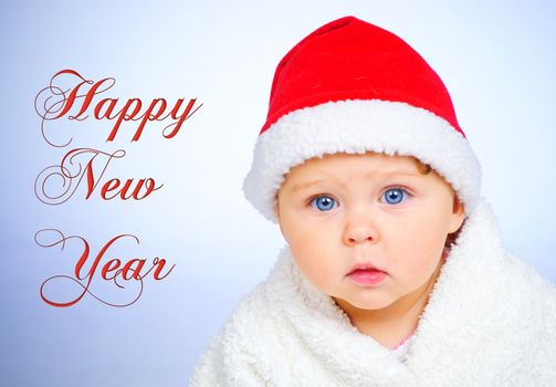Christmas theme: little Santa - clouseup portrait baby girl in santa claus hat