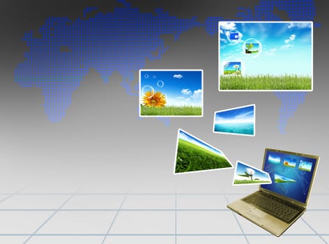 Multimedia concept with modern laptop on green field.