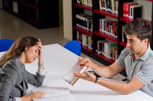 Guy trying to encourage his girlfried to keep on with her studies