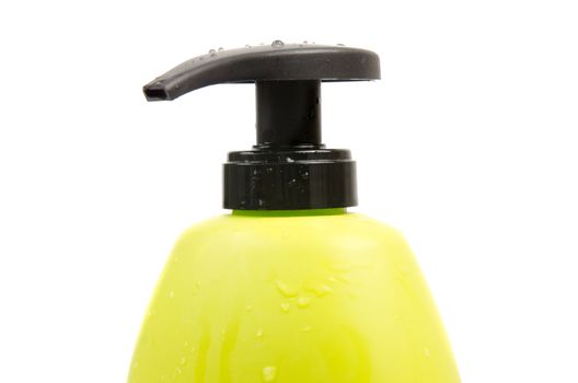 Close up of green shampoo bottle cap. Isolated on white background