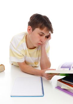 A boy reading or studying textbooks.