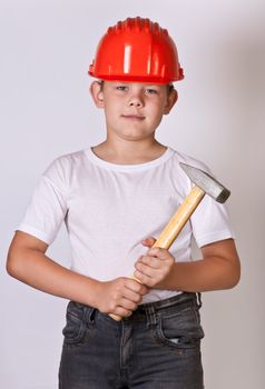 Portrait of a boy in a red protective helmet