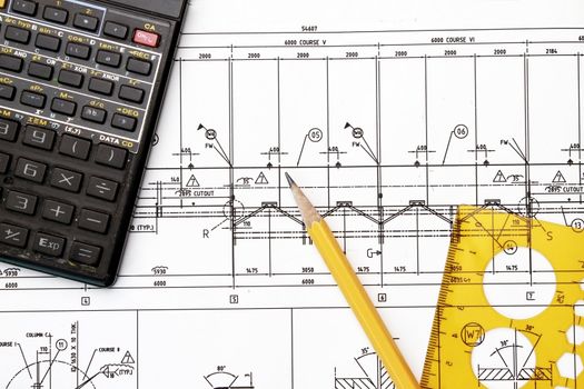 Blueprint, calculator, pencil and tempaltes - tolls in drafting works.