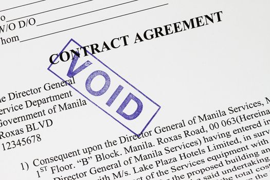 Void stamp imprint on a contract agreement.

