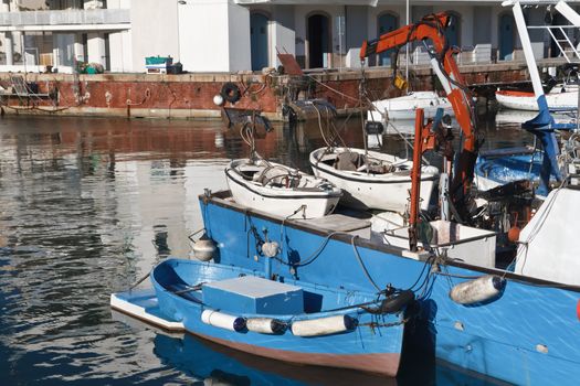 dock with fishing boat in Genova harbor, Italy