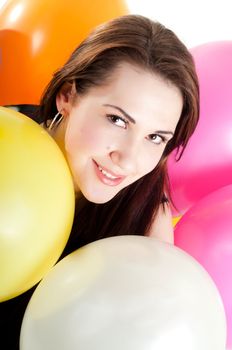 Shot of beautiful woman with multicolored air balloons isolated on white