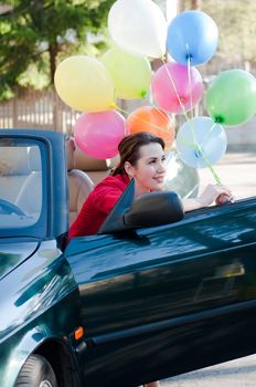 Shot of beautiful brunette woman in car