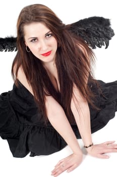 Shot of beautiful brunette woman with black wings