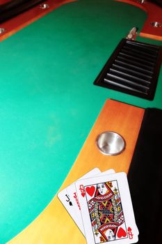 green casino table with copy space and the jack of spades representing a blackjack game