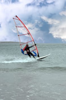 person windsurfing in the maharees in county kerry ireland during a storm