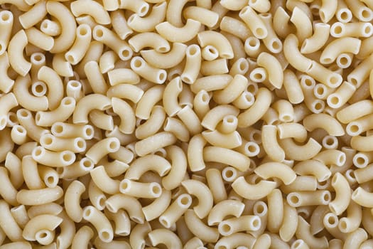 Food background of dried macaroni pasta.