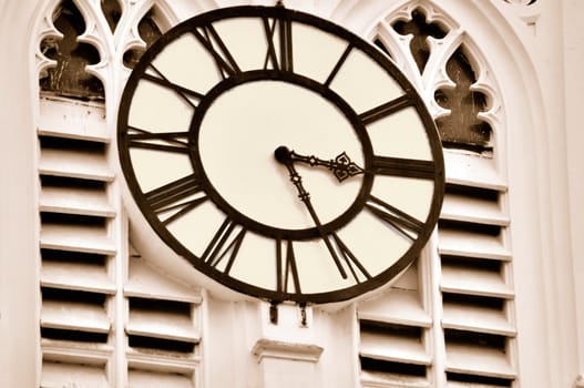 A old clock on the wall of the tower of St. Paul's Cathedral, Calcutta (Digitally Altered)