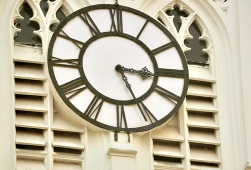A old clock on the wall of the tower of St. Paul's Cathedral, Calcutta