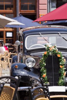 A Classic Car on a restaurant terrace in summer
