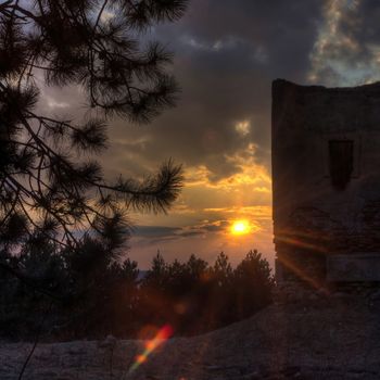 The old church on the background of a sunset