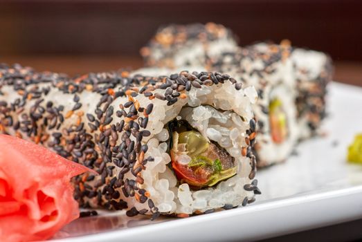 Closeup of Sushi rolls at plate with sesame