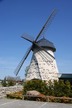 Ancient windmill on a background of the blue sky