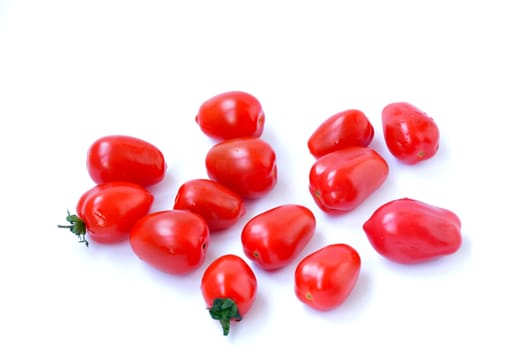 Cherry tomato fruits on a white background