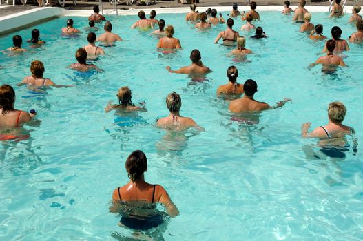 People are doing aerobic in pool