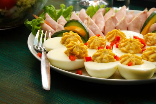 Photo shot of the eggs and pork on table