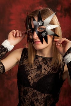 Image of a girl wearing black star mask