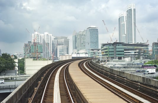 Cityscape with railway and high office buildings in Kuala Lumpur, Malaysia