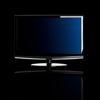 Modern lcd TV isolated over a black background with reflection