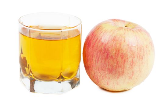 Fresh apple juice in a glass and red apple over white background