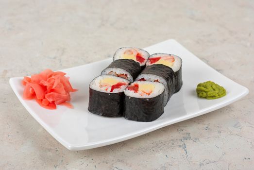 Sushi rolls made of crab meat, cheese, and tomato