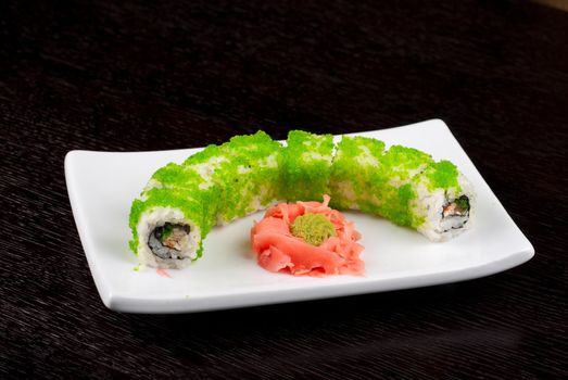 Sushi rolls made of salmon, avocado, flying fish roe - tobiko caviar and philadelphia cheese