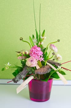 bunch of flowers composition at pot on a table