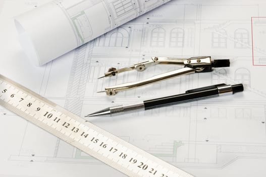 Architectural plan with tools on white background