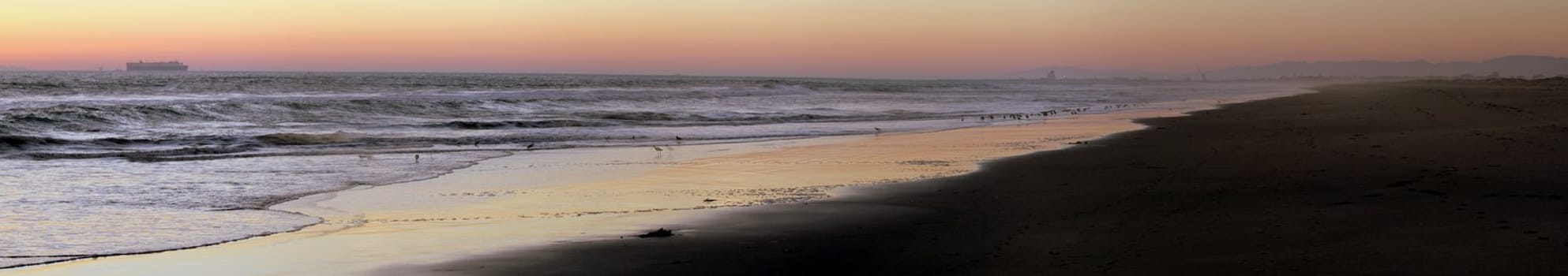 sunset at Ormond Beach with beautiful sky and blue water